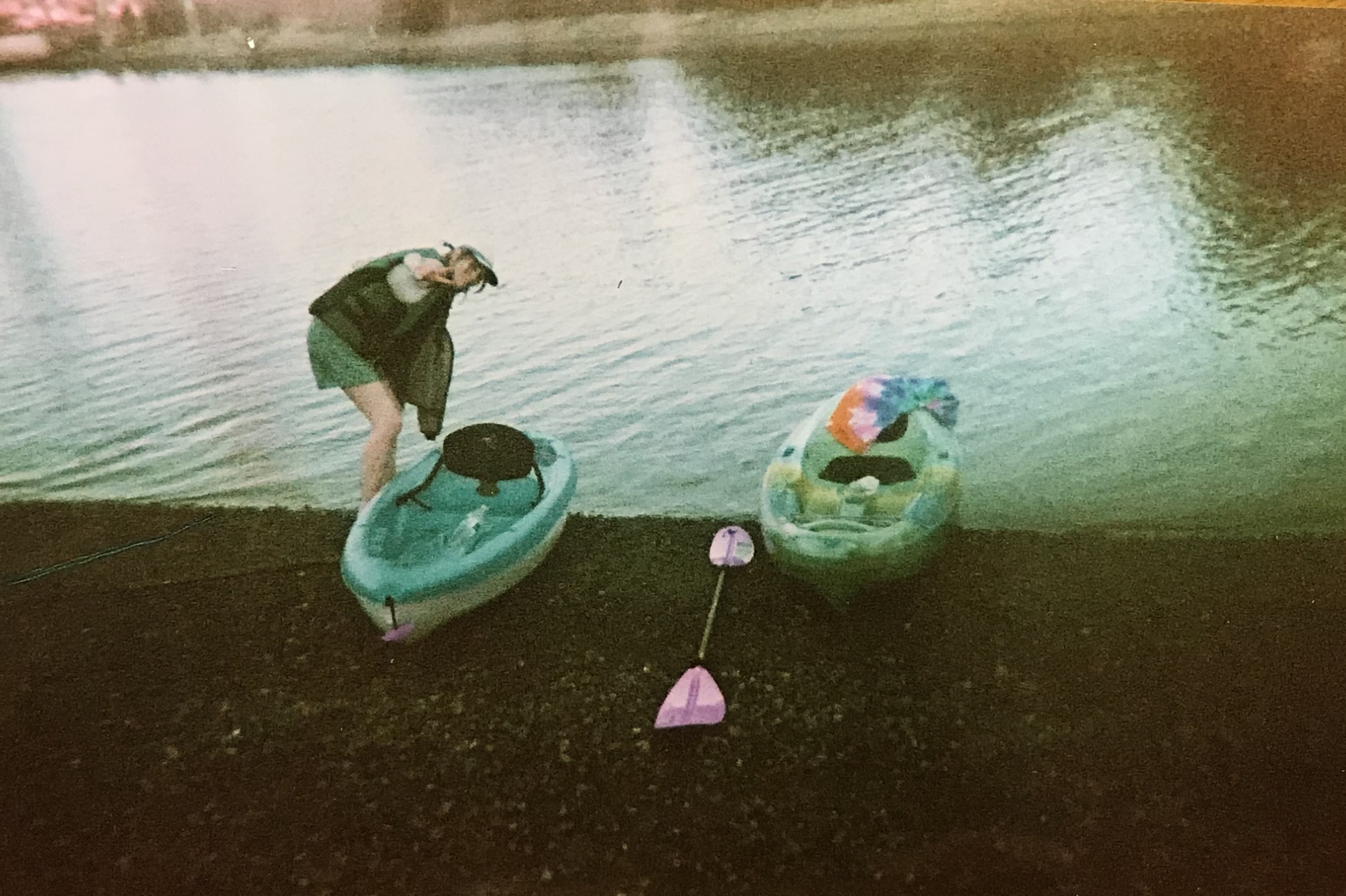 Tyler Wasnock, OP Student Director photo, shown entering a kayak