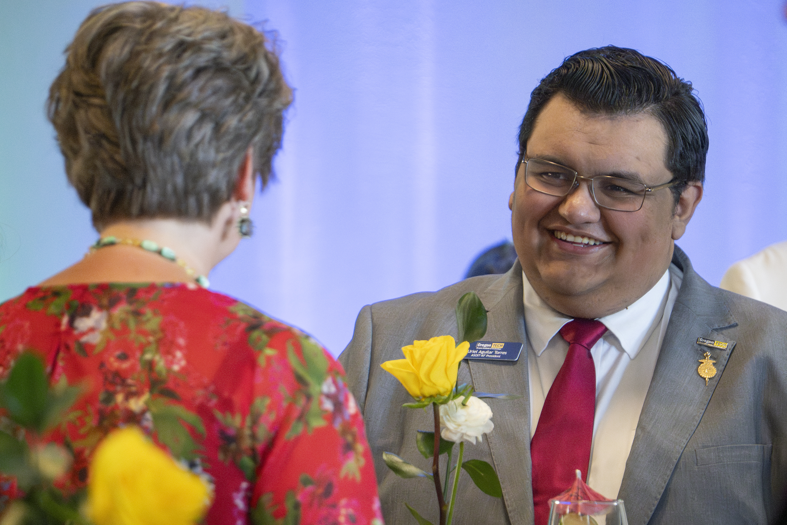 Student smiling at an event
