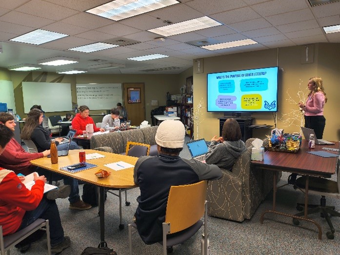 TOP students listen attentively to Cassy Harter, Career Advisor, presentation.
