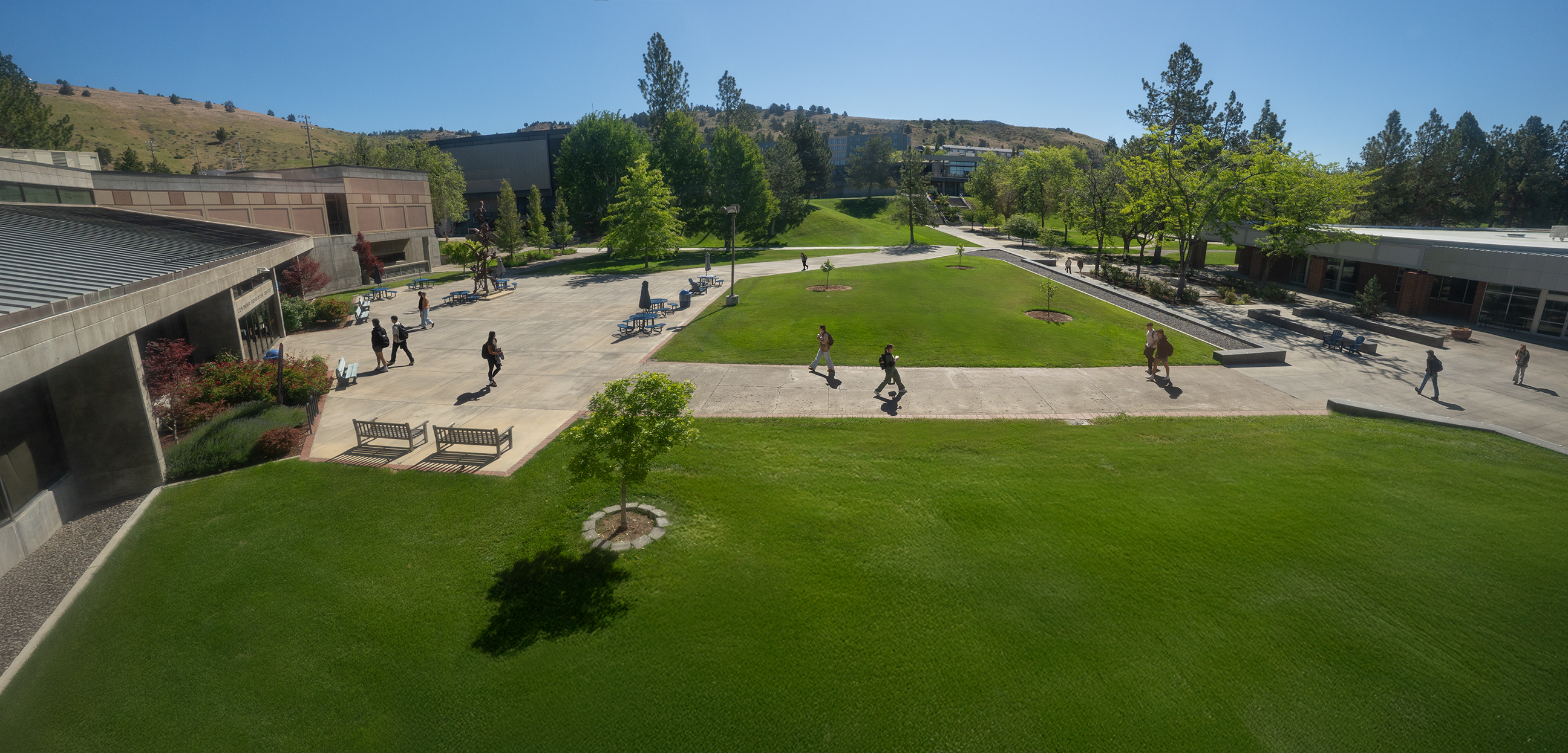 Aerial view of Oregon Tech campus near the library with students walking around. 
