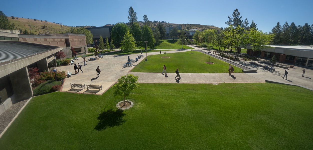 Aerial view of Oregon Tech campus near the library with students walking around. 