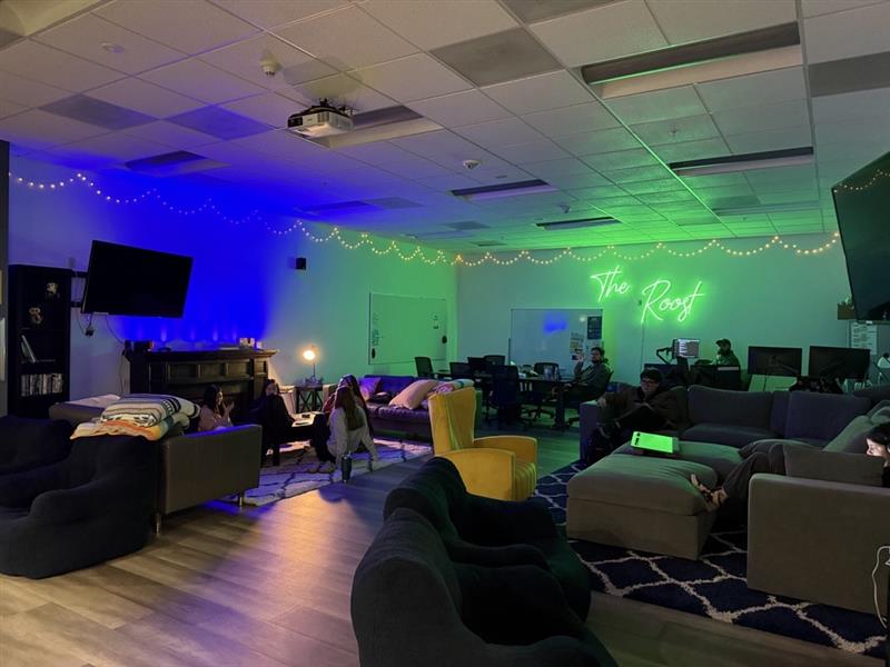 The photo shows "The Roost" Student Lounge on the fourth floor of the Portland-Metro campus. This space is managed by ASOIT-PM. It has couches, a table, dry erase boards, an Xbox, Nintendo Switch, and many table top games.