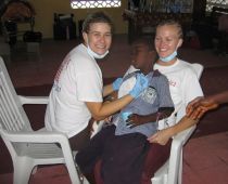 Sydney Craven and Ashley Nichols examine child