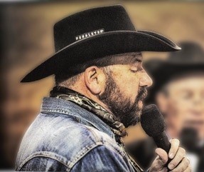 picture of Scott Allen announcing at a rodeo event