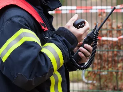 HDR firefighter operates walkie talkie