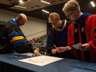 Bradley R. Newcomer, Pake Melland, and Christopher J. Syrnyk at Phi Kappa Phi Installation