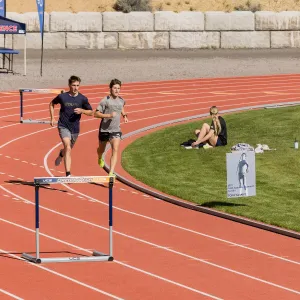 Student athletes running on a track