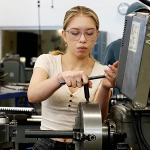 Student working with a machine