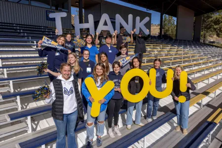 Students holding thank you sign