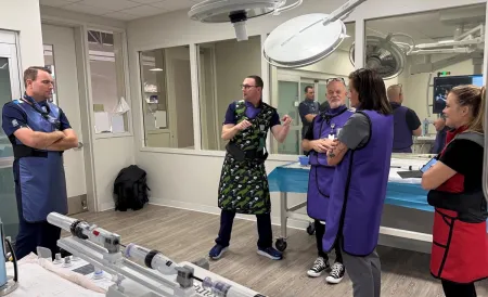 Josh Gilles at medical facility with co-workers