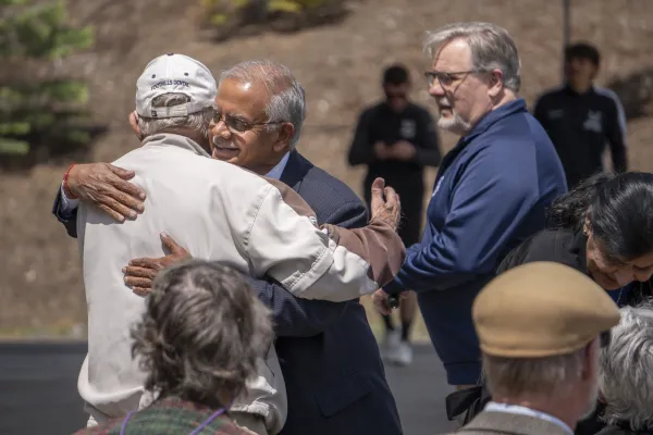 Dr. Nagi Naganathan and Glen Thomet hugging